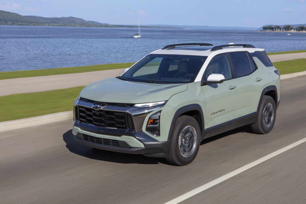 2026 Chevrolet Equinox driving beside a lake, featured in Chevrolet Equinox Review