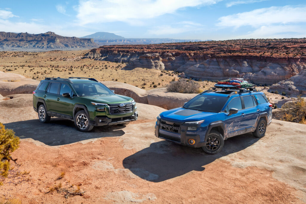 Subaru Outback Review 2026 shows two models tackling desert terrain with rugged styling and off-road readiness.