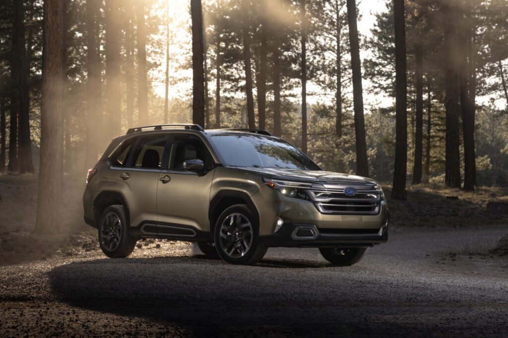 2026 Subaru Forester parked in a forest during golden hour, featured in Subaru Forester Review