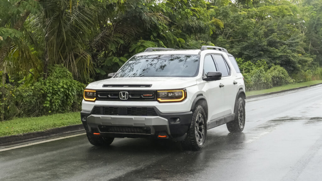 Honda Passport Review image of a white 2026 Honda Passport TrailSport on a wet road