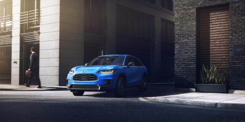 Honda HR-V Review image of a blue 2026 Honda HR-V parked curbside in a city setting