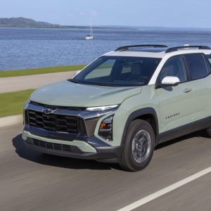 2026 Chevrolet Equinox driving beside a lake, featured in Chevrolet Equinox Review