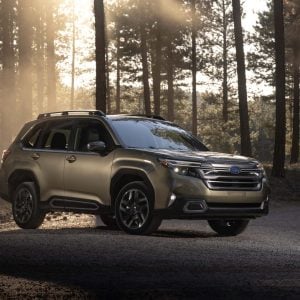 2026 Subaru Forester parked in a forest during golden hour, featured in Subaru Forester Review