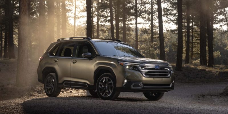 2026 Subaru Forester parked in a forest during golden hour, featured in Subaru Forester Review